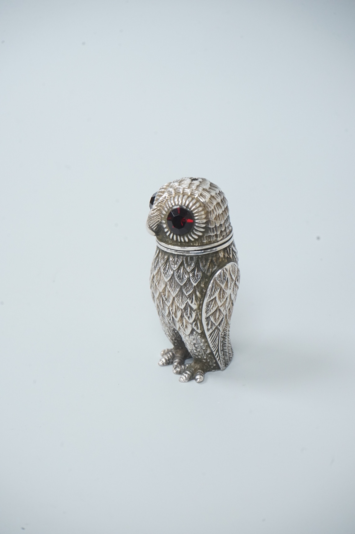 A novelty silver plated condiment, modelled as an owl, with two faceted glass eyes, height 66mm.